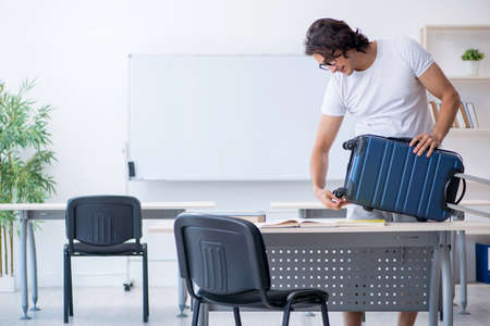 Young male student in front of whiteboardの写真素材