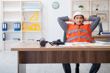 The young male architect working in the officeの写真素材