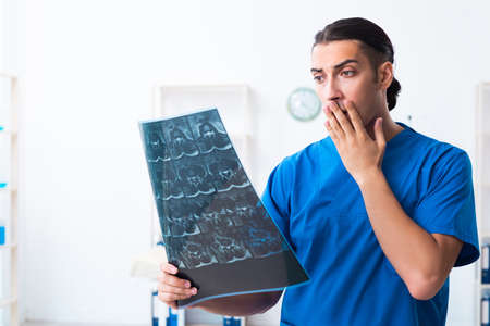 Young male doctor working in the clinic
