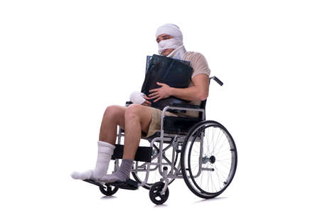 Injured man in wheel-chair isolated on whiteの写真素材