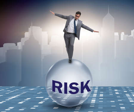 Young businessman in business risk and uncertainty concept