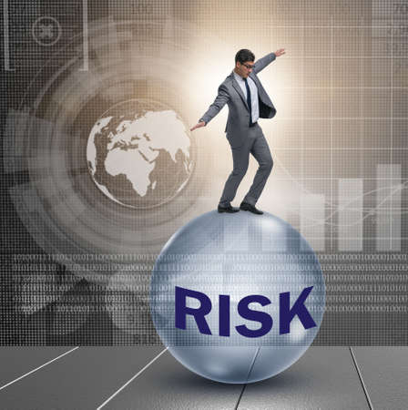 Young businessman in business risk and uncertainty concept