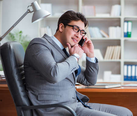 Young businessman working in the officeの写真素材