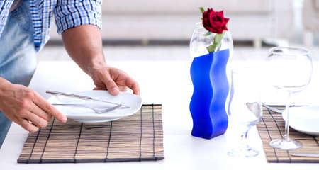 Man alone preparing for romantic date with his sweetheart