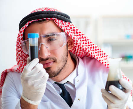 Arab chemist working in the lab officeの写真素材