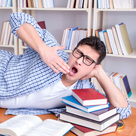 Young student taking break and falling asleepの写真素材