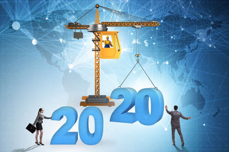Crane lifting year 2020 in business concept