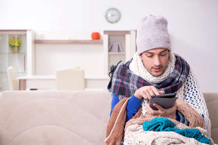 Young man suffering at homeの写真素材