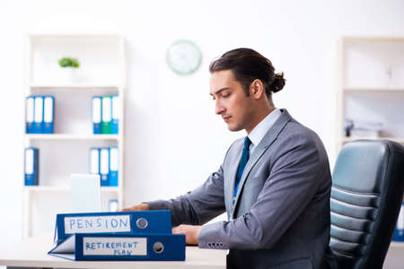 Young male accountant working in the officeの写真素材