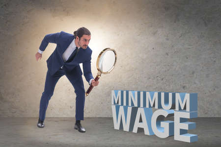 Concept of minimum wage with businessmanの写真素材