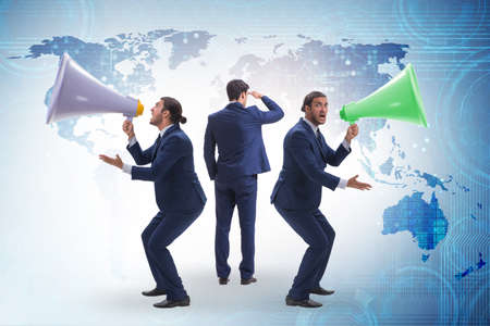 Businessman shouting through large loudspeakerの写真素材