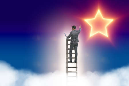 Businessman reaching out for stars