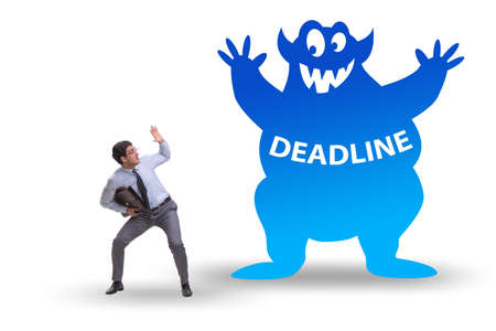 Businessman missing important deadline with monsterの写真素材