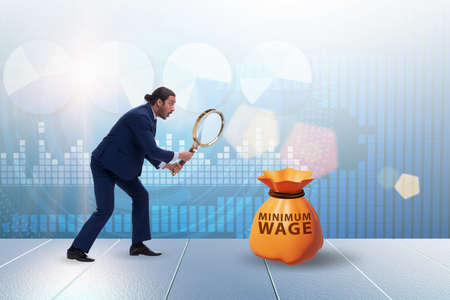 Concept of minimum wage with businessmanの写真素材