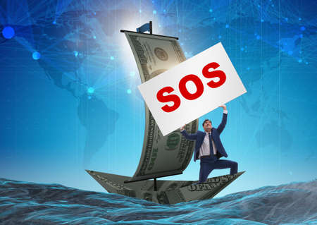 Businessman asking for help with SOS message on boatの写真素材