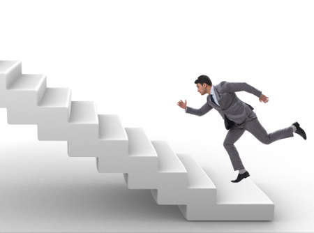 Businessman climbing career ladder in business conceptの写真素材