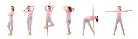 Young woman doing exercises on whiteの写真素材