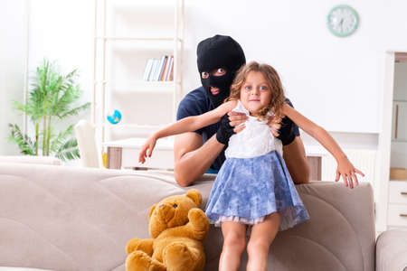 Child trafficking and abuse concept with small girlの写真素材