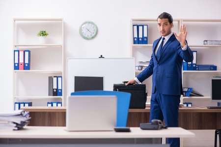 Young male businessman working in the officeの写真素材