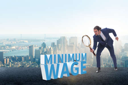 Concept of minimum wage with businessmanの写真素材