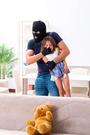 Child trafficking and abuse concept with small girlの写真素材