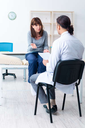 Mentally ill woman patient during doctor visitの写真素材