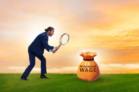 Concept of minimum wage with businessmanの写真素材