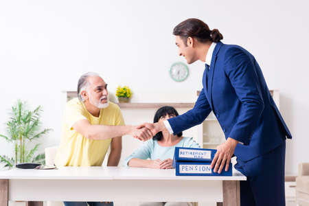 Financial advisor giving retirement advice to old coupleの写真素材