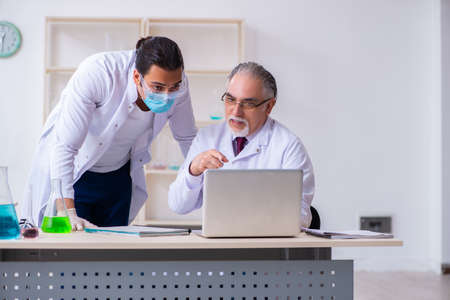 Two chemists working in the lab
