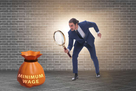 Concept of minimum wage with businessmanの写真素材
