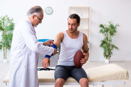 Young male patient visiting experienced doctorの写真素材