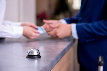 The hotel reception bell at the counterの写真素材