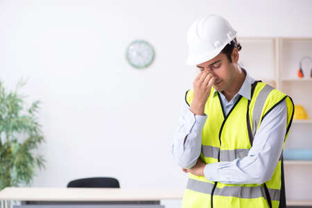 Young male architect working in the office