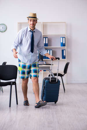 Young employee escaping for summer vacationの写真素材