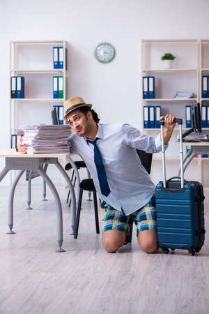 Young employee escaping for summer vacationの写真素材