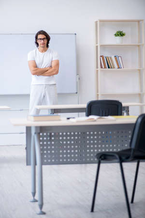 Young male student in front of whiteboardの写真素材