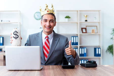 King businessman at his workplaceの写真素材