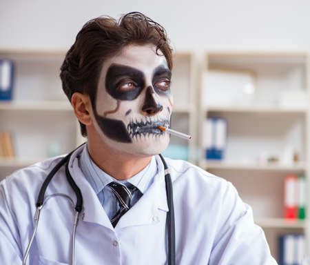 Scary monster doctor working in labの写真素材