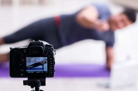 Sports and health blogger recording video in sport conceptの写真素材
