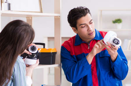 The client getting securty camera installed at home by contracto