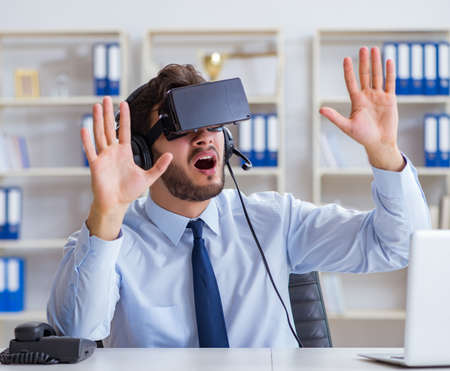 Businessman gamer in office playing games