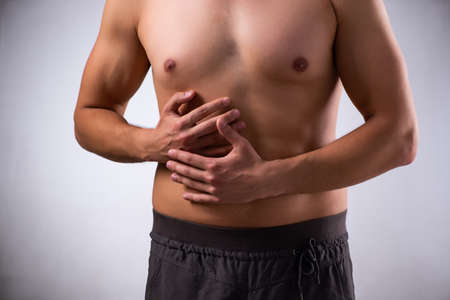 Young man suffering from stomachache