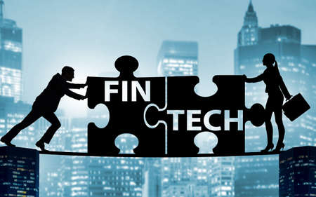 Fintech financial technology concept with puzzle piecesの写真素材