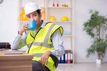 Young male architect working in the officeの写真素材