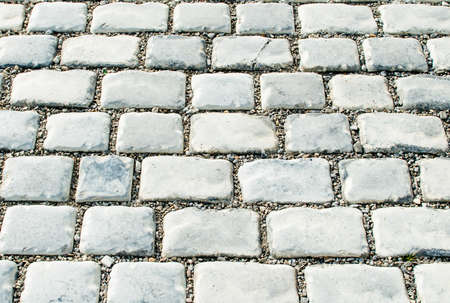The road paved with cobble stones for your background