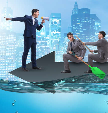 The teamwork concept with businessmen on boatの写真素材