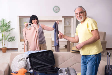 Old couple preparing for vacation travelの写真素材