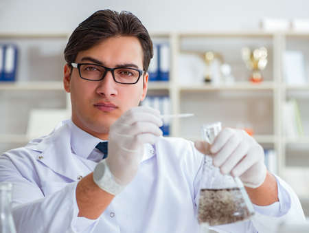 Young researcher scientist doing a water test contamination expeの写真素材