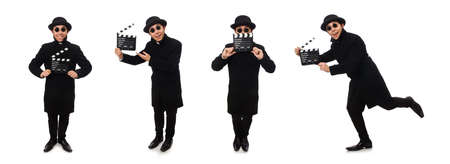 Young man with clapper-board isolated on whiteの写真素材