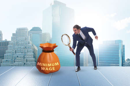 Concept of minimum wage with businessmanの写真素材